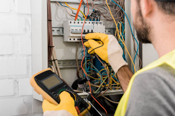 depositphotos_217089698-stock-photo-cropped-image-electrician-checking-electrical